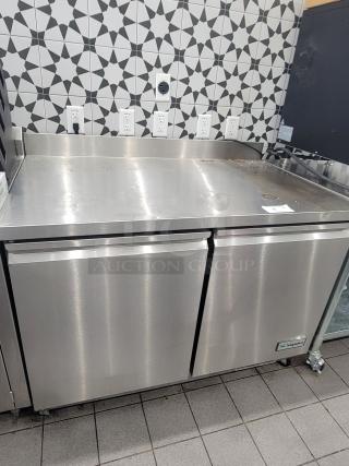Supera PWTR48-SI 4' refrigerated work top counter with casters, stainless steel, dual doors, good condition.