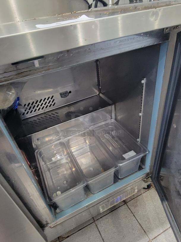 Supera PWTR48-SI, 4' refrigerated worktop counter, stainless steel, on casters, internal storage with clear containers, used condition.