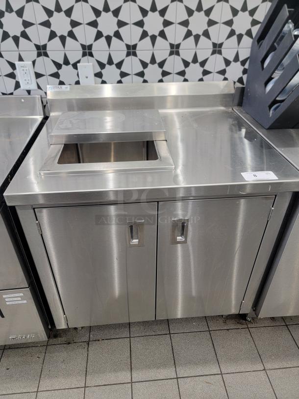 Titan 3' cold well work station with drain sink, stainless steel, dual-door cabinet, good condition, visible TITAN label.