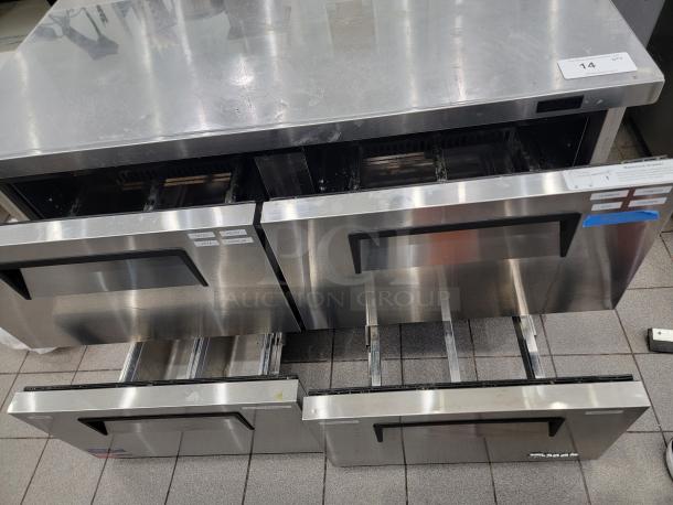 Turbo Air TWR-48SD-D4-N undercounter fridge, 4 drawers, stainless steel, worktop surface. Slight wear visible. Model tag shown.