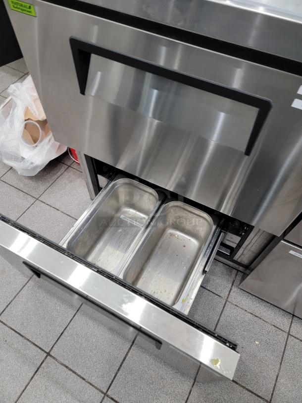 Turbo Air TWR-48SD-D4-N undercounter fridge, 4 drawers, stainless steel, visible drawer with two metal pans.