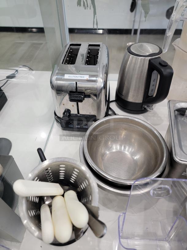 Restaurant kitchen essentials lot including a stainless steel toaster labeled "Gluten Free," electric kettle, mixing bowls, and utensils. Good condition.