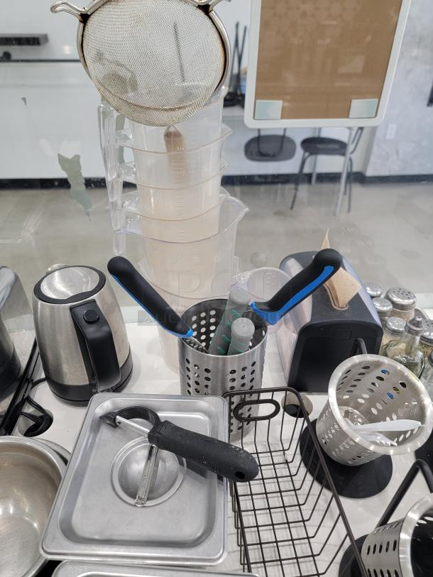 Restaurant cafe kitchen essentials lot including toaster, kettle, utensils, and mesh strainer. Good used condition.