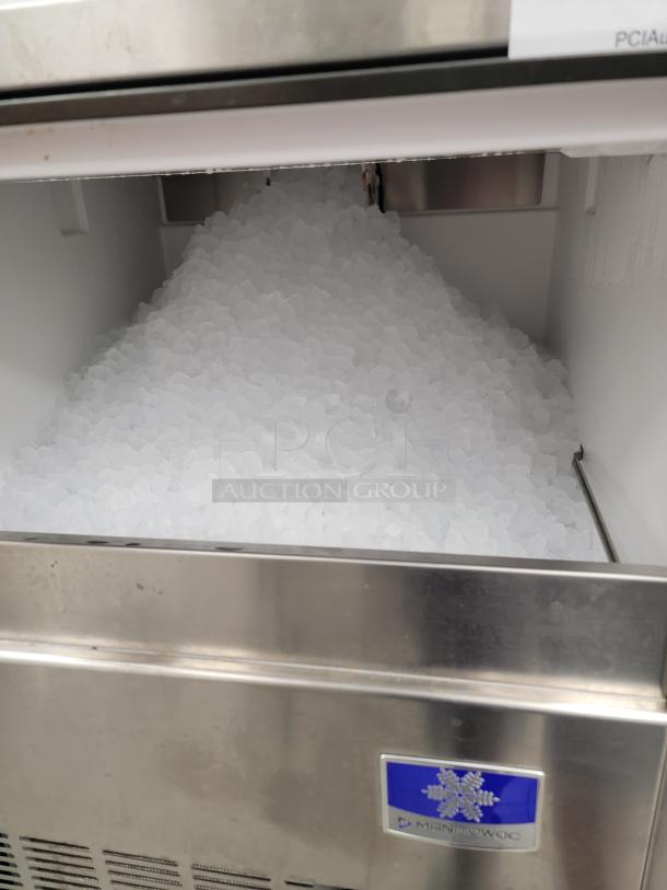 Pentair nugget ice maker model UNP0200A-161 in excellent condition, loaded with ice, stainless steel finish.