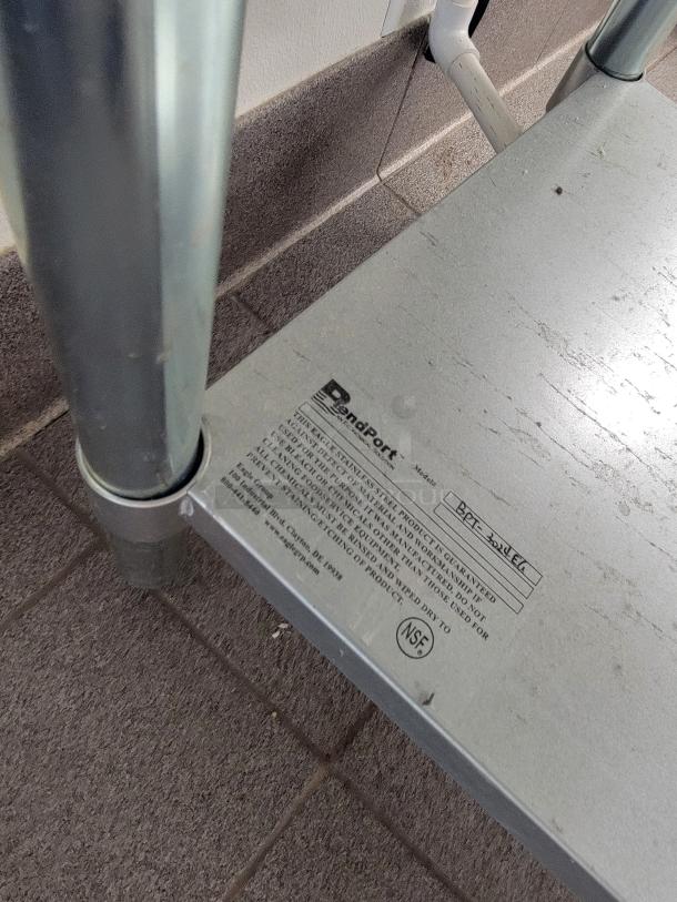 Stainless steel prep table with model label "BPT-301EG." Durable metal frame, ideal for commercial kitchen use.