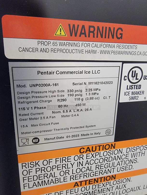 Pentair Commercial Ice Maker model UNP0200A-161, serial M11621042023, excellent condition, includes safety warnings and specs.