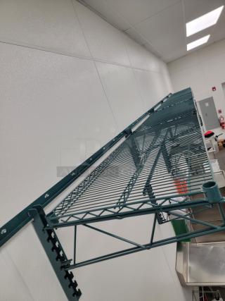 Metro green epoxy wall-mount wire shelving, approx. 40 linear feet. Highly adjustable, corrosion-resistant for commercial use.
