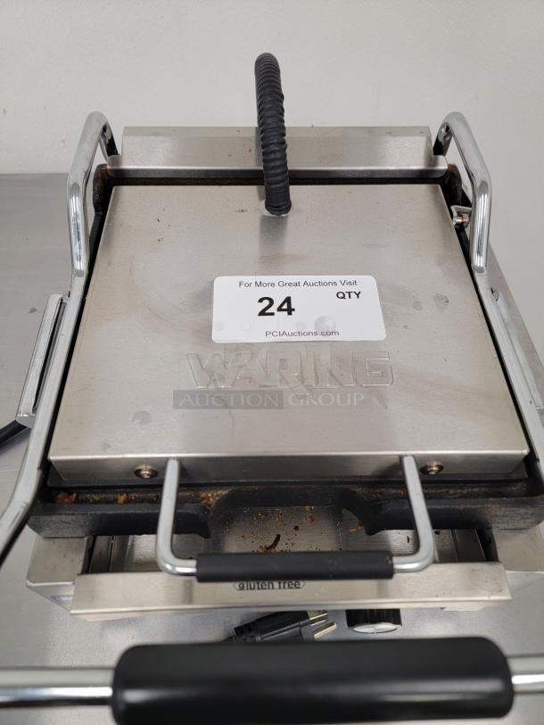 Waring Commercial Panini Grill, Model UNP0200A-161, stainless steel, commercial use, even cooking, durable, with label showing auction info.