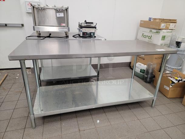 6-foot commercial stainless steel work table with undershelf, durable and versatile for kitchen or workshop use.