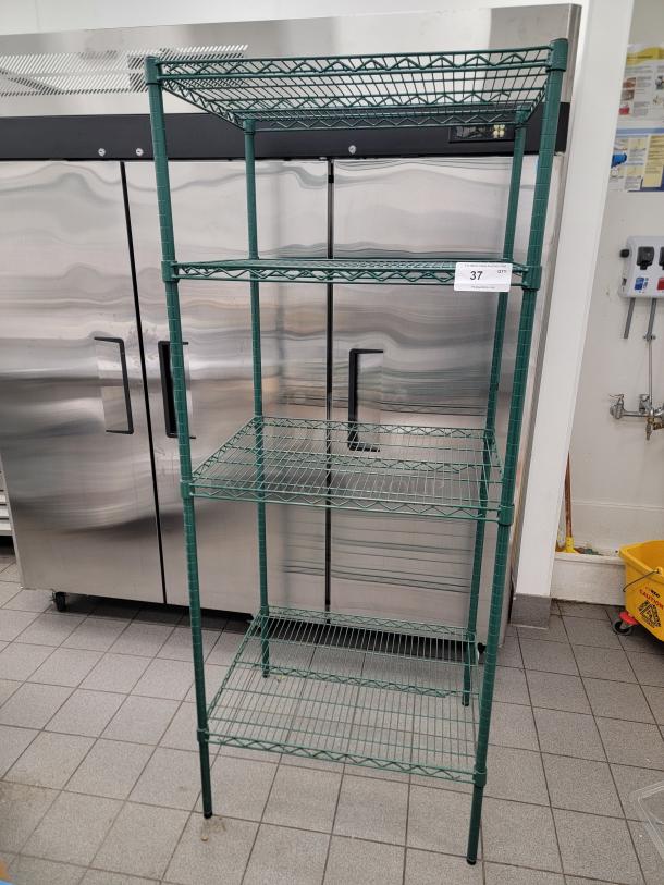 Winco VEX-2430 4-tier epoxy-coated wire shelf, durable storage solution, ideal for kitchens or garages. Appears in good condition.