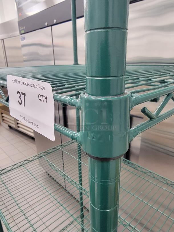 Winco VEX-2430 epoxy-coated 4-tier wire shelf in green, ideal for kitchen storage. Visible tag reads "For More Great Auctions Visit."