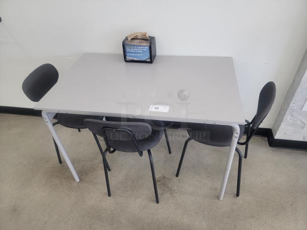 IKEA GRÅSALA table with three ÖSTANÖ chairs, gray, compact, ideal for small spaces, modern design, minimal wear.