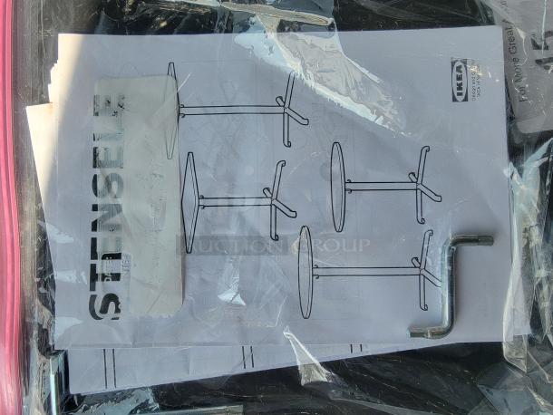 IKEA assembly instructions and Allen key for round dining table. Includes diagrams and IKEA branding.