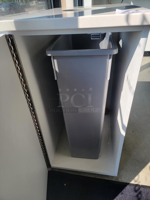 Modern indoor commercial waste receptacle with grey bin on casters, ideal for restaurants and offices. Sleek design for discreet use.