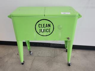 Vibrant green portable outdoor cooler with "Clean Juice" logo, large capacity, on wheels, excellent condition. Perfect for events.