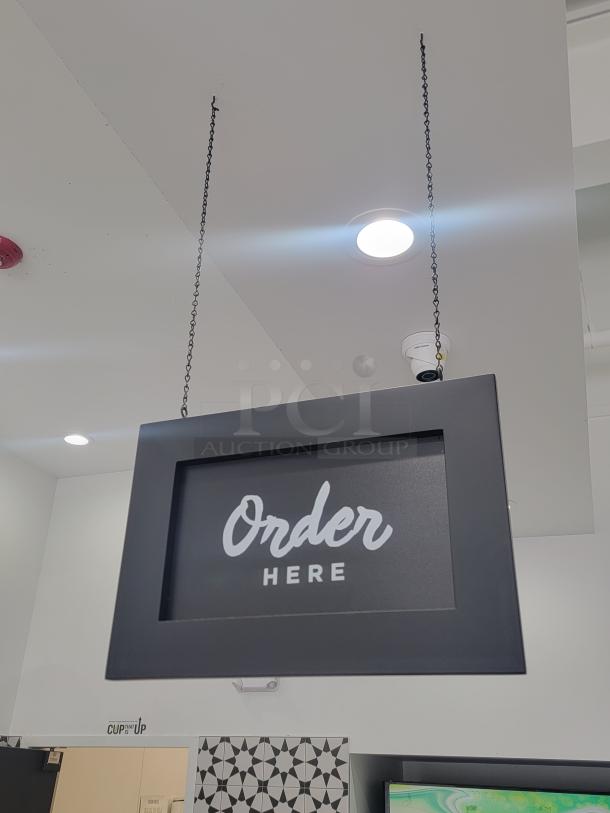 Set of 2 hanging signs, "Order Here" & "Pick Up Here," in sleek black frames for cafes or retail. Excellent condition.
