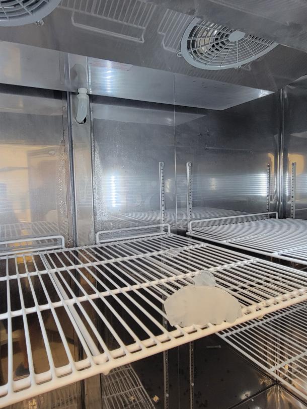 Supera PCF3-SI-HC 3-Door Commercial Refrigerator interior, showing wire shelving and cooling fans, ideal for high-volume use.