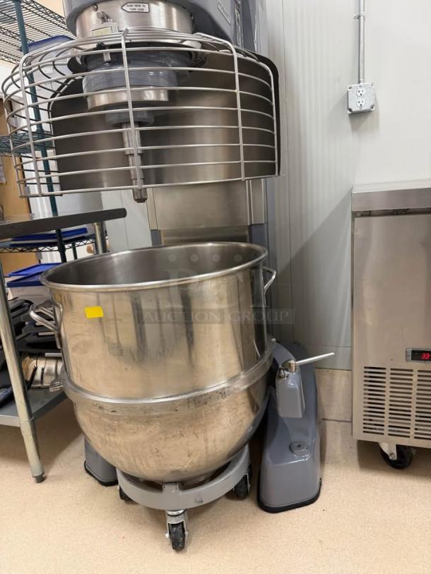 Hobart 1410 commercial mixer, like new, with stainless steel bowl, dolly, and paddle attachment. Perfect for large batches.