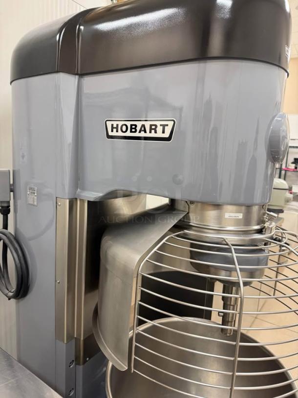Hobart 1410 140-quart commercial mixer, like new condition, includes 2 mixing bowls, dolly, and paddle attachment.