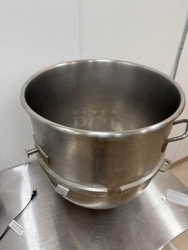 Hobart 140-quart stainless steel mixing bowl, like new, featuring handles and secure locking mechanism. Ideal for commercial use.
