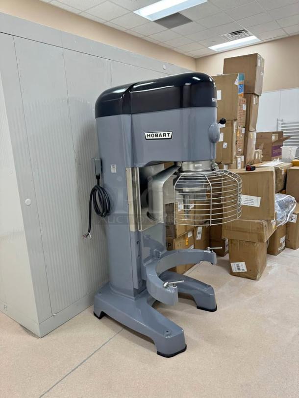 Hobart 1410 140-Quart Commercial Mixer, like new, with bonus mixing bowls, dolly, and paddle attachment. Ideal for large batches.