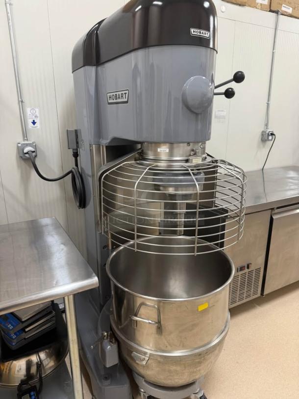 Like new Hobart 1410 commercial mixer, 140-quart capacity, includes bonus mixing bowls, dolly, and paddle attachment.