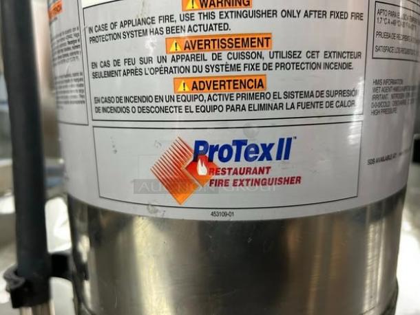 Protex II Wet Chemical Fire Extinguisher, Model H-25715296, in excellent condition, with multilingual safety warnings.
