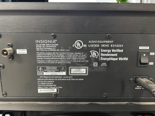 Insignia NS-HAIOR18 stereo shelf system, labeled back panel with power switch, USB, antenna input, UL and energy verification.