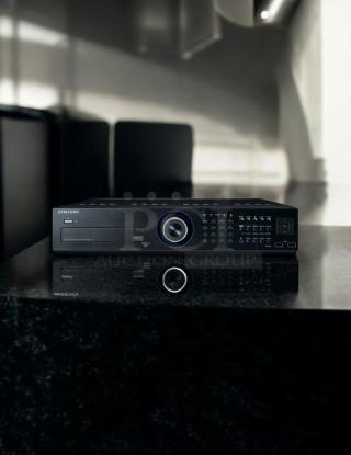 Samsung SRD-1652D DVR, 16-channel, 3TB storage, excellent condition, fully tested, front control panel, black finish.