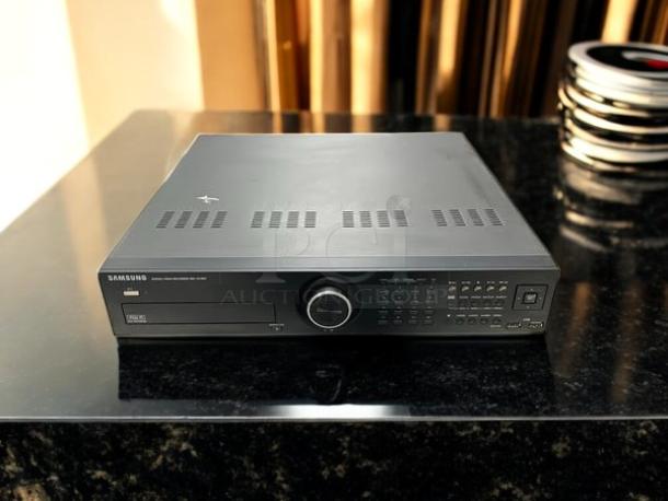 Samsung SRD-1652D 16ch DVR, awesome condition, 3TB, fully tested. Display panel with buttons and dial.