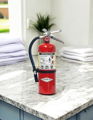 AMEREX B500 fire extinguisher in great condition on countertop. Features clear instruction label, tested and fully working.