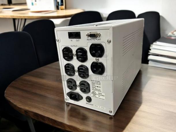 Opti-UPS ES1500C 980W 1400VA line-interactive UPS, 8 outlets, great condition. Fully tested and working, model label visible.