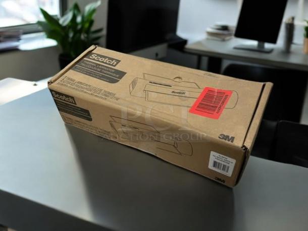 Brand new Scotch TL901X Thermal Laminator in sealed box, with model and brand details on packaging, showcasing unopened condition.