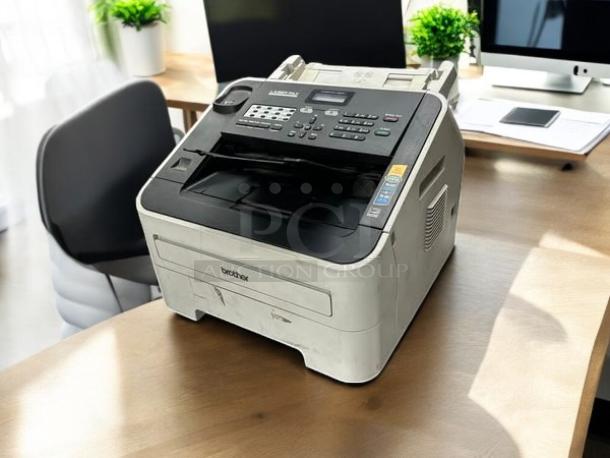 Brother IntelliFAX-2840 laser fax machine in excellent condition on desk, fully tested with clear control panel and labels.