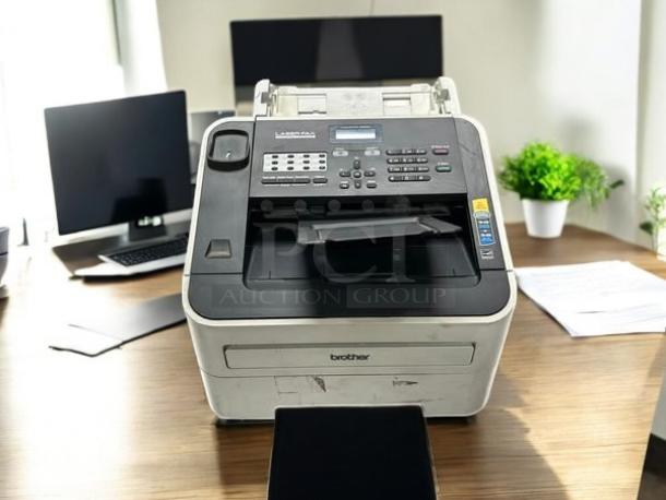 Brother IntelliFAX 2840 laser fax machine in excellent condition on a wooden desk, fully tested and functional.
