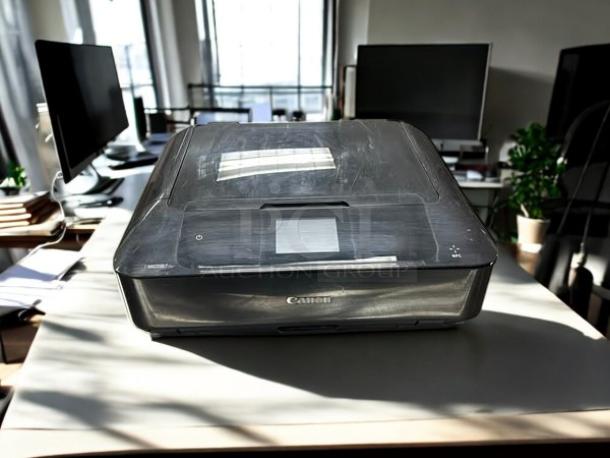 Canon Pixma MG7720 printer in excellent condition, fully tested and working. Features touchscreen, sleek design.