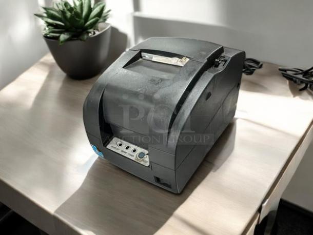 BIXOLON SRP-275III impact printer, black, excellent condition, fully tested, visible control panel, on a wooden desk.