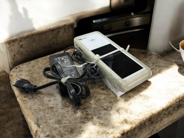 Clover Flex K400 in great condition, fully tested and working, with charger and cords, on a marble surface.