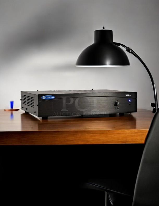 Crown 180A 80W professional power amplifier in excellent condition on wooden desk, with brand and model labels visible.