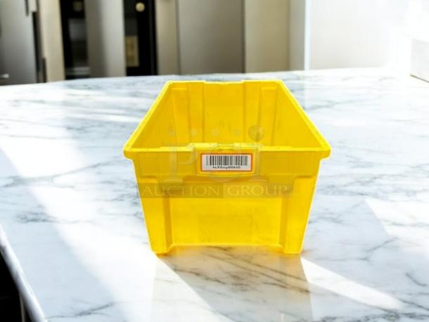 Yellow storage container in great condition on a marble surface, featuring a barcode label.