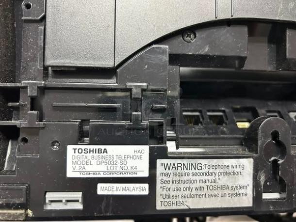 Toshiba DP5032-SD digital telephone in excellent condition, made in Malaysia, with model and safety labels visible.