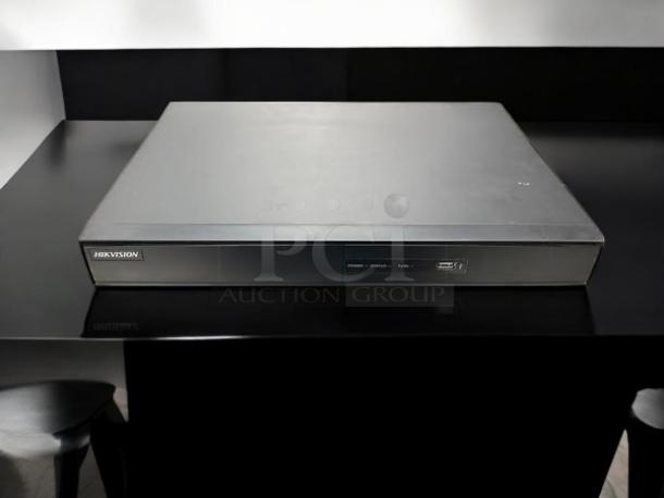 Hikvision AcuSense iDS-7208HQHI-M2/S 8-Channel DVR, great condition, fully tested, sleek black design, front USB port.