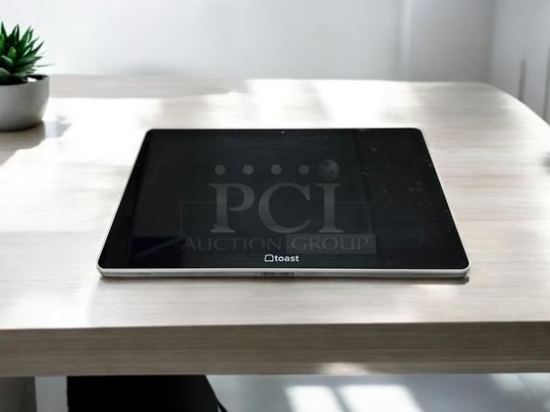 Toast Flex touchscreen POS monitor, model TK200, in excellent condition, fully tested and functional, black finish.
