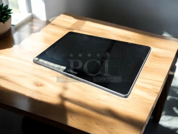 Toast Flex TK200 POS touchscreen monitor in amazing condition, black. Fully tested and working, displayed on a wooden surface.
