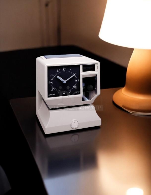 AMANO TCX-11 time clock in great condition, 6 7/8in x 8 1/4in, fully tested and working, model 4TH70.