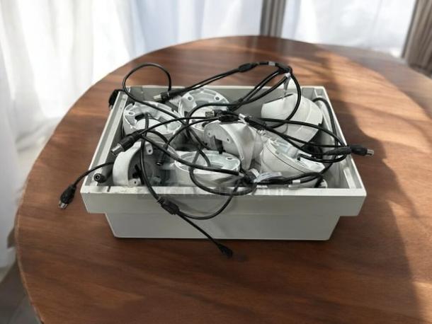 White Dahua HDCVI security cameras in a bin, in excellent condition, cables attached, fully tested and working.