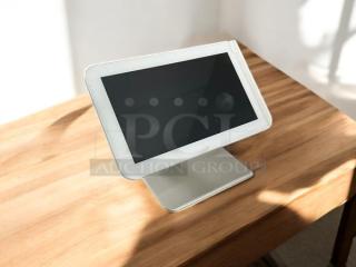 Clover C100 touchscreen POS system, excellent condition, silver stand, fully tested and working, on wooden table.