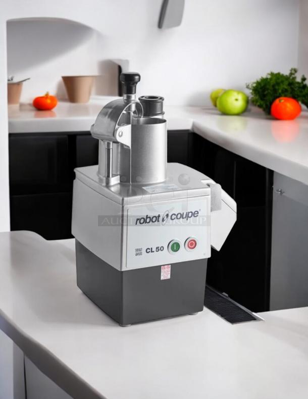 Robot Coupe CL50 food processor, perfect condition, includes 3 discs. Features 1 1/2 hp motor, tested and working.