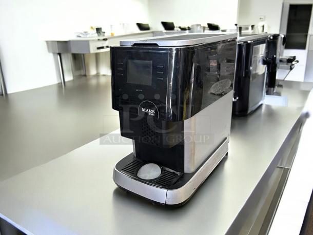 FLAVIA Model MDKL1NA Mars brewer in black, good condition, tested and working, 115v, sleek design with label.