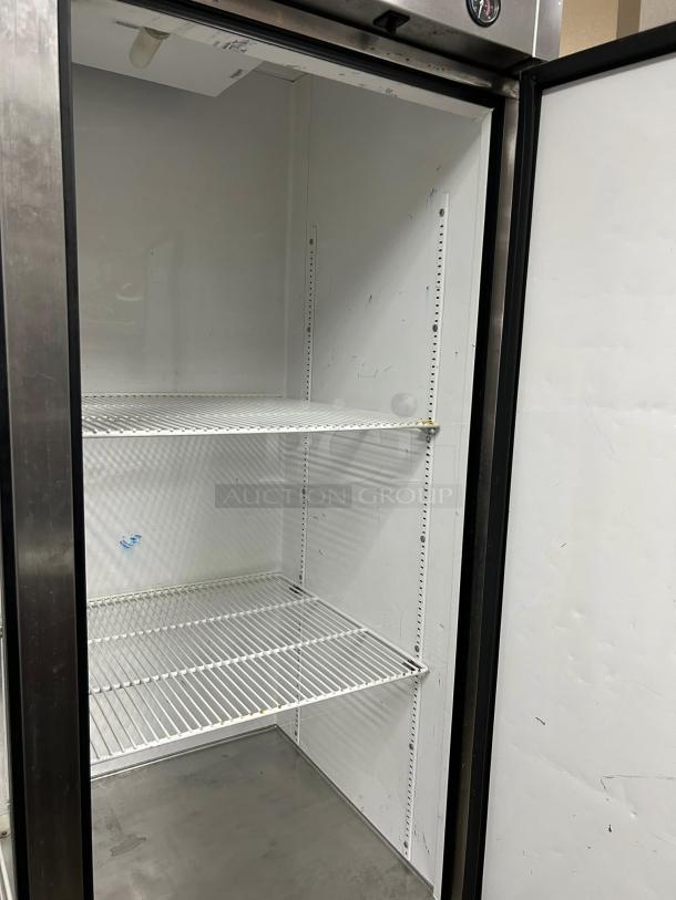 True T-49-HC 54" two-section reach-in refrigerator, stainless steel, two wire shelves, tested and working, clean interior.
